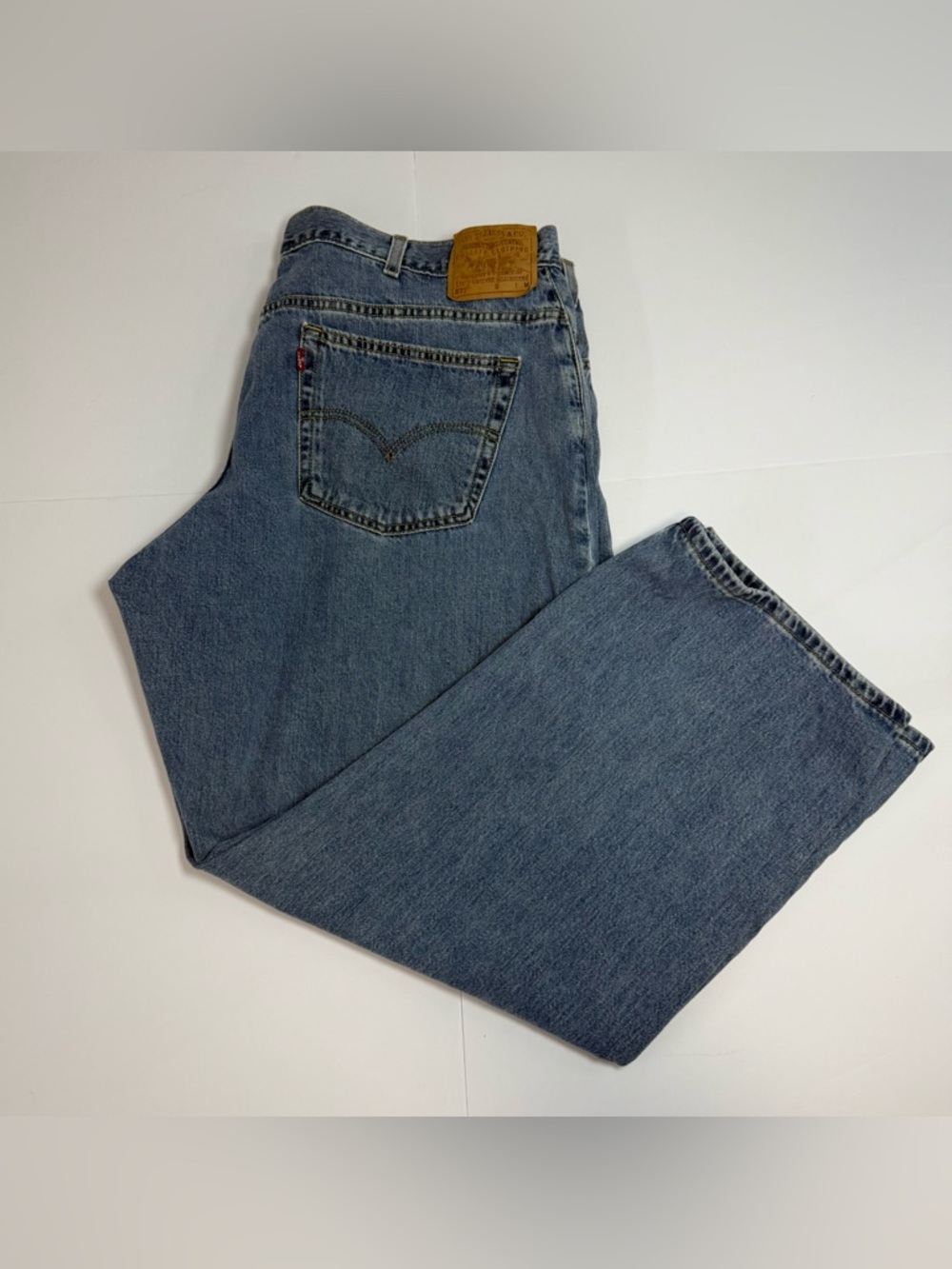 Vintage Levi's 577 Light Blue Denim Jeans with Leather Patch 22W